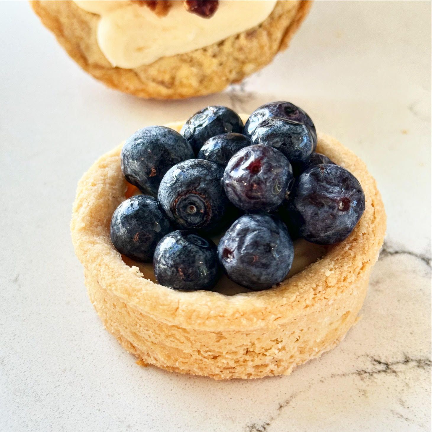 A blueberry tart from the Taste 154 bake case